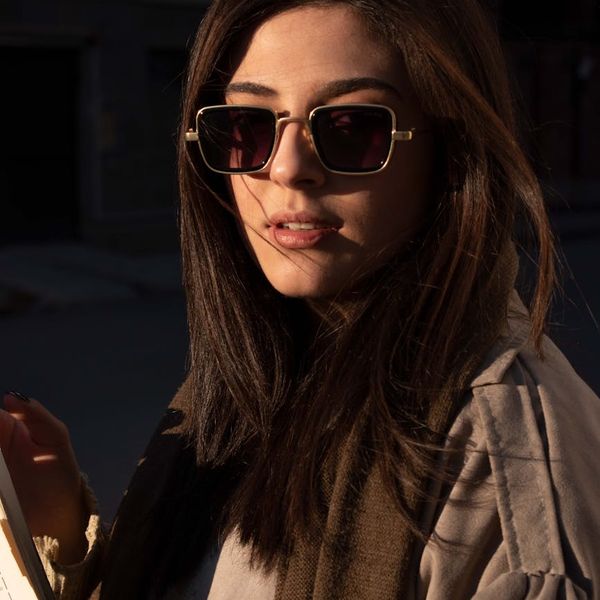 Person feeling energized and happy outdoors under the sun.